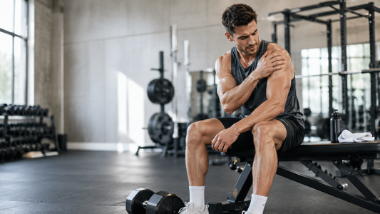 Muscular athlete pausing after a demanding resistance-training set
