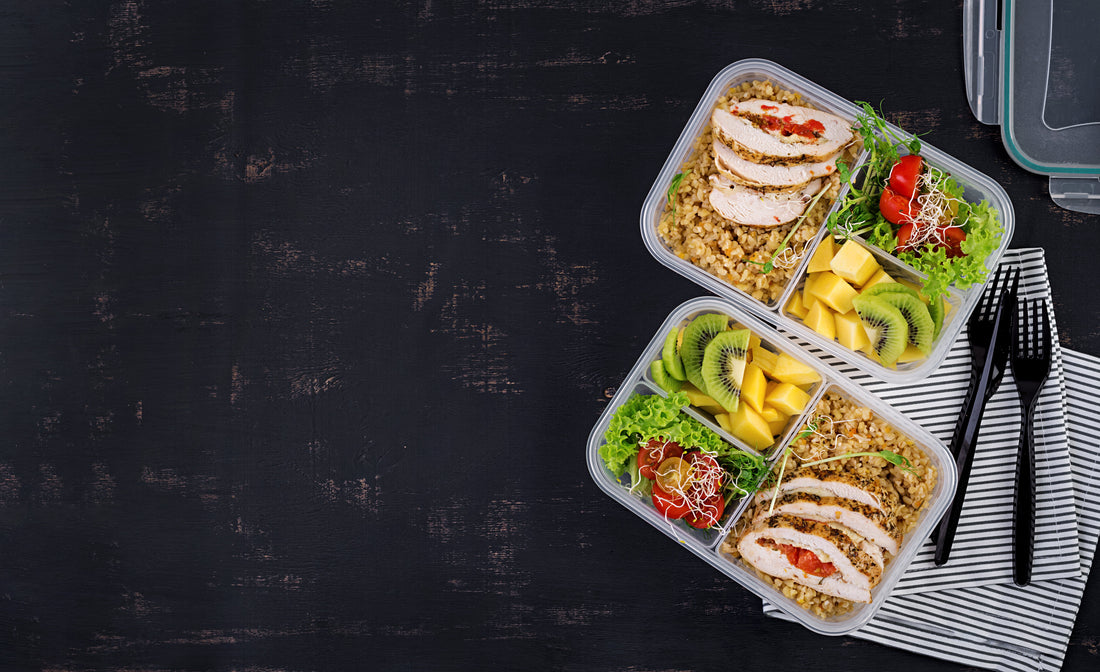 Balanced pre-workout meal with chicken, grains, vegetables and fruit