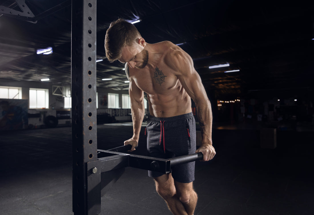 Athlete performing pull-ups as a compound upper-body exercise for the arms and back