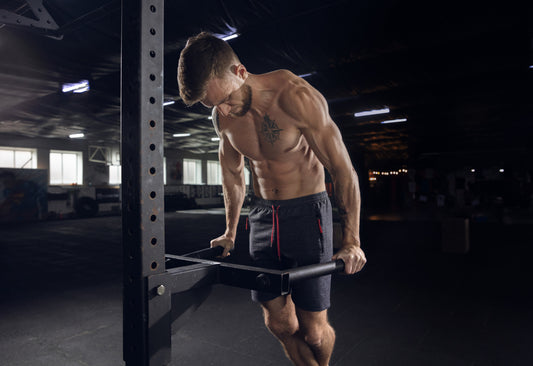 Athlete performing pull-ups as a compound upper-body exercise for the arms and back